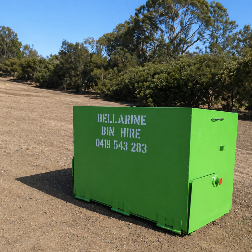 2.4m3 Green skip bin with 'Bellarine Bin Hire' branding in a natural setting.