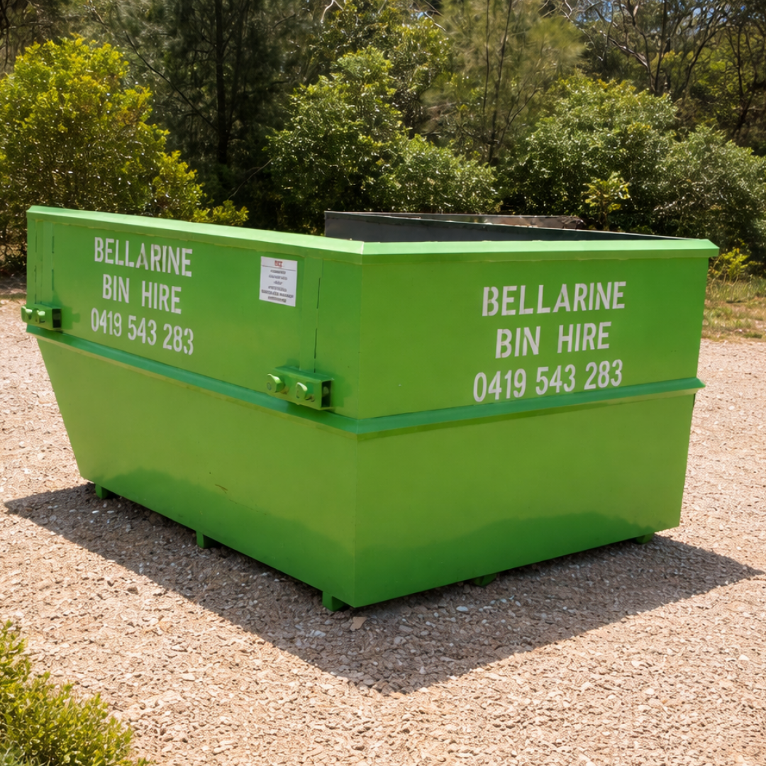 Green 5.5m skip bin with 'Bellarine Bin Hire' branding and contact details, set against a natural background.